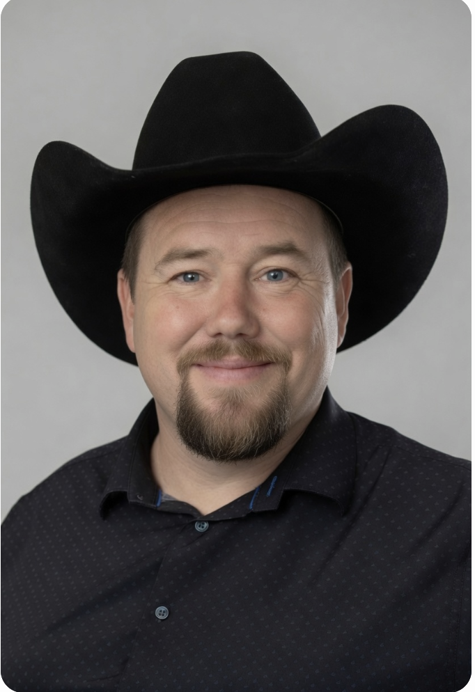 Nick, your friendly local tech helper, smiling in a cowboy hat.
